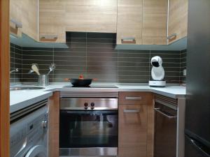 Kuchyň nebo kuchyňský kout v ubytování Relájate en Ramales de la Victoria, apartamento con piscina y parking