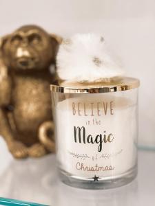 a candle in the magic of christmas next to a monkey at Sea Elegance in Oliveri