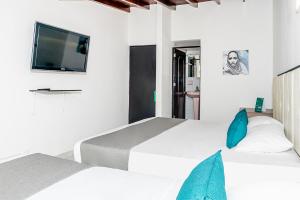 TV a/nebo společenská místnost v ubytování Ayenda Casa San Pablo