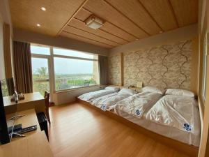 Cama o camas de una habitación en 玉灣鵬灣民宿Jade Bay B&B