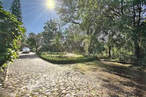 a cobblestone road with a car parked on it at Casa Jacobina Tepoztlán in Tepoztlán +4 photos