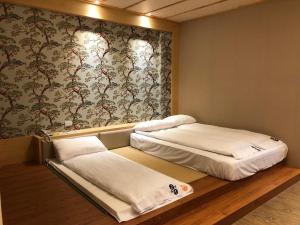 Cama o camas de una habitación en 玉灣鵬灣民宿Jade Bay B&B