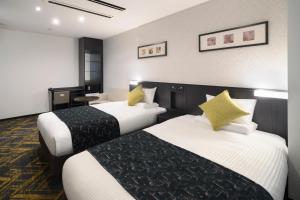 Cama o camas de una habitación en HOTEL MYSTAYS Hamamatsucho