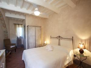 Кровать или кровати в номере Azienda Agrituristica Le Chiuse