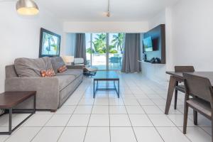 a living room with a couch and a table at Girasole Rentals Suites in Miami Beach
