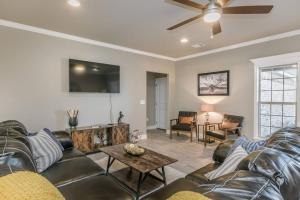 a living room with couches and a ceiling fan at Beautifully Decorated New Home, King Bed, Washer/Dryer & Fully Stocked Kitchen in Canyon