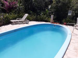 Swimmingpoolen hos eller tæt på Chácara Cantinho da Paz