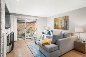 a living room with a couch and a table at 700 Monarch 104 in Aspen