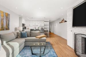 a living room with a couch and a fireplace at 700 Monarch 104 in Aspen