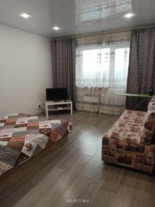 Cama ou camas em um quarto em Apartment Аэропорт Иркутска