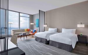 Uma cama ou camas num quarto em Niccolo Suzhou