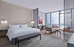 Uma cama ou camas num quarto em Niccolo Suzhou