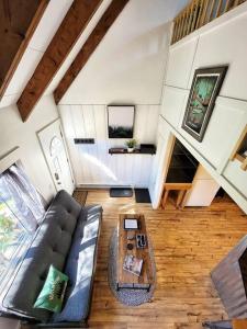 a living room with a couch and a coffee table at The Davis Loft in Davis