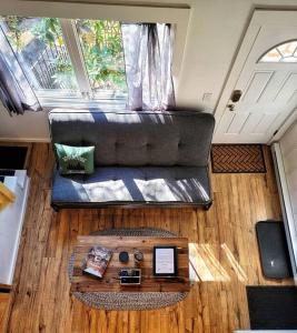 a living room with a couch and a table at The Davis Loft in Davis