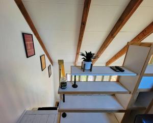 a staircase in a house with a plant on it at The Davis Loft in Davis