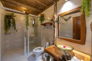 a bathroom with a toilet and a shower and a sink at Mafiya Resort in Koh Rong Island