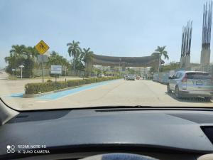 a view from a car windshield of a road with cars at depto relajante Diamante in Acapulco