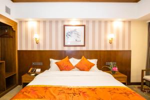 Voodi või voodid majutusasutuse Fu Hua Hotel toas