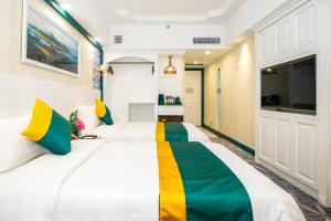 Voodi või voodid majutusasutuse Fu Hua Hotel toas