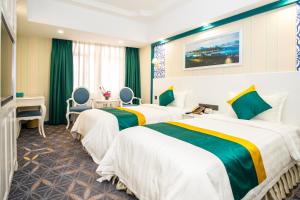 Voodi või voodid majutusasutuse Fu Hua Hotel toas