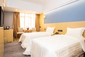 Voodi või voodid majutusasutuse Fu Hua Hotel toas