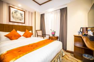 Voodi või voodid majutusasutuse Fu Hua Hotel toas