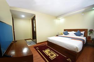 Letto o letti in una camera di Karma Hotel Nepal