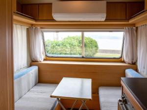 直島町ふるさと海の家 つつじ荘 -SeaSide Park Stay Tsutsujiso-的休息区
