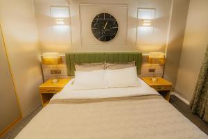 A bed or beds in a room at La Palace Exclusive Design