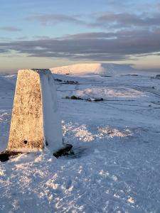 a block of ice in a field with snow at Dales View House in Barnoldswick