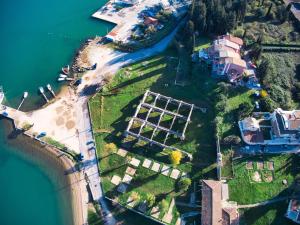 an aerial view of a house on an island in the water at Sirena Beach in Gouvia