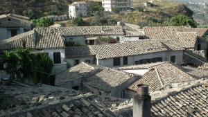 a group of roofs in a village on a hill at Casa Ferrari in Gerace