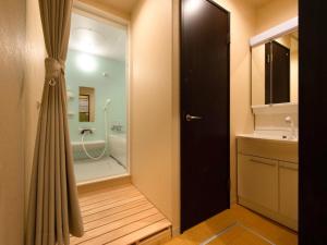 Koupelna v ubytování Guest House Suzumeno Kakurembo