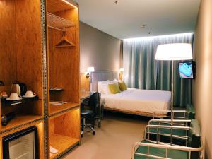 Postel nebo postele na pokoji v ubytování IND Hotel