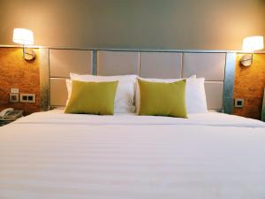 Postel nebo postele na pokoji v ubytování IND Hotel