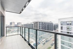 an apartment balcony with a view of a city at Prymasa Tysiąclecia 83A (D) by Homeprime in Warsaw