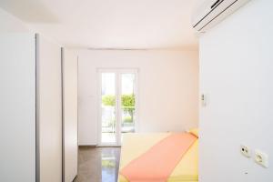 Postel nebo postele na pokoji v ubytování Apartment and Rooms Mato