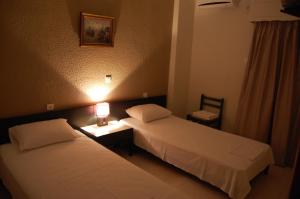 Voodi või voodid majutusasutuse Hotel Antirriο toas