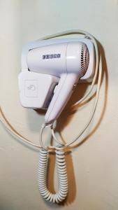a hair dryer hooked up to a blow dryer at Ashley Hotel in Cork
