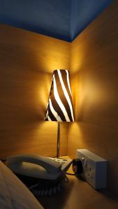 Letto o letti in una camera di Ashley Hotel