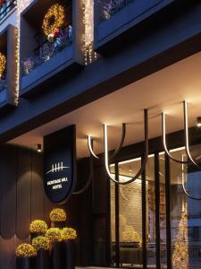 a store front with a chandelier hanging from the ceiling at Heritage Hill Hotel in Athens