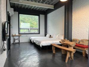 Postel nebo postele na pokoji v ubytování Huatian Yilu