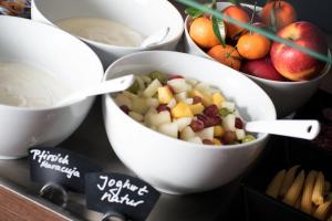 a group of bowls filled with fruits and vegetables at Am Berghang in Bad Bentheim