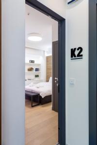 A bed or beds in a room at K2 SUITE