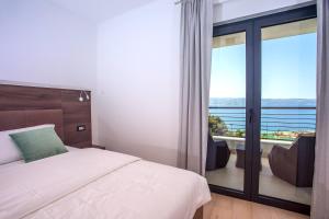 Posteľ alebo postele v izbe v ubytovaní Seaview holiday home Lemona + 37 fotografií