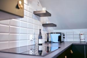 Kuchyňa alebo kuchynka v ubytovaní LAGUNA Apartament Polanica Residence 59 z klimatyzacją