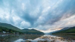 a view of a river with mountains in the background at Arrochar Hotel 'A Bespoke Hotel' in Arrochar