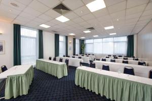 a conference room with white tables and chairs at Wyndham Garden Duesseldorf Mettmann in Mettmann +30 photos
