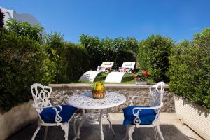 a table and chairs sitting on a patio at Hotel Al Mulino in Anacapri