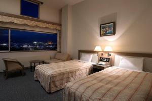 Postel nebo postele na pokoji v ubytování Izumigo AMBIENT Azumino Hotel + 37 fotografií